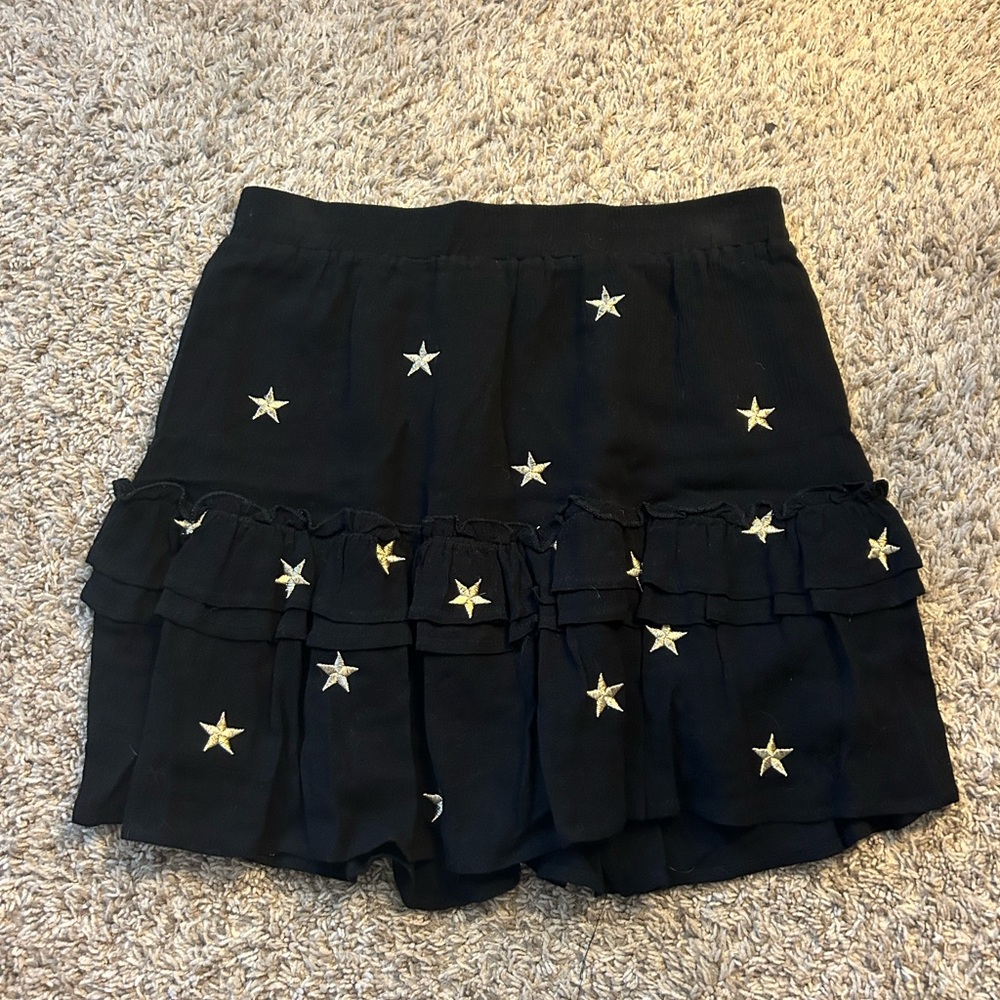 mini black skirt with gold stars! in great condition!